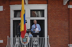 Assange reading a statement from the embassy balcony in 2013.